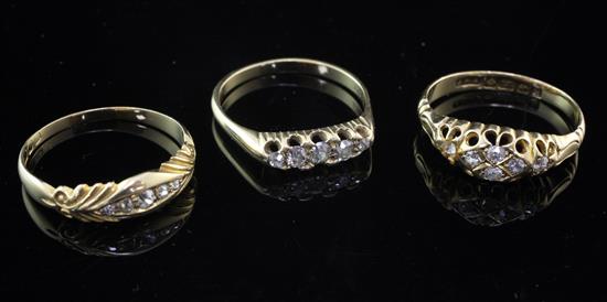 Three early 20th century 18ct gold and diamond set rings, sizes P,Q & R.